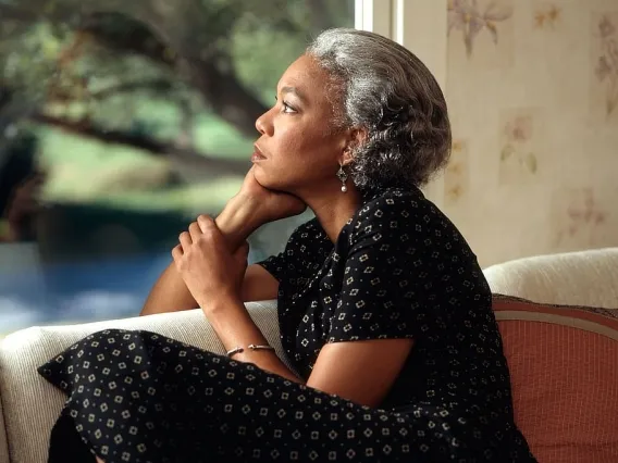 Woman thinking and looking out a window